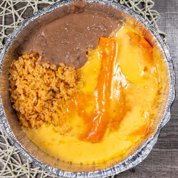 Mexican combo meal with refried beans, rice, and cheese enchiladas in a foil container.